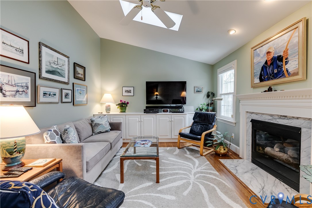 498 St Albans Way Henrico, VA 23229 - Photo 18 of 46 a living room with furniture a flat screen tv and a fireplace