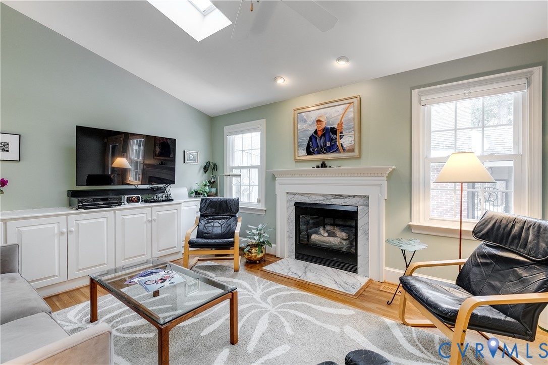 498 St Albans Way Henrico, VA 23229 - Photo 19 of 46 a living room with furniture a flat screen tv and a fireplace