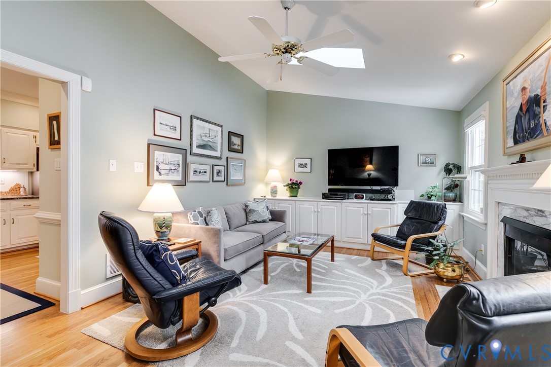 498 St Albans Way Henrico, VA 23229 - Photo 22 of 46 a living room with furniture a flat screen tv and a fireplace