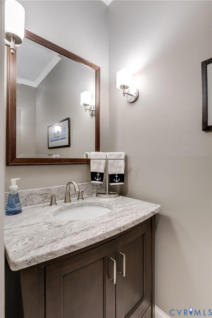 498 St Albans Way Henrico, VA 23229 - Photo 23 of 46 a bathroom with a granite countertop sink and a mirror