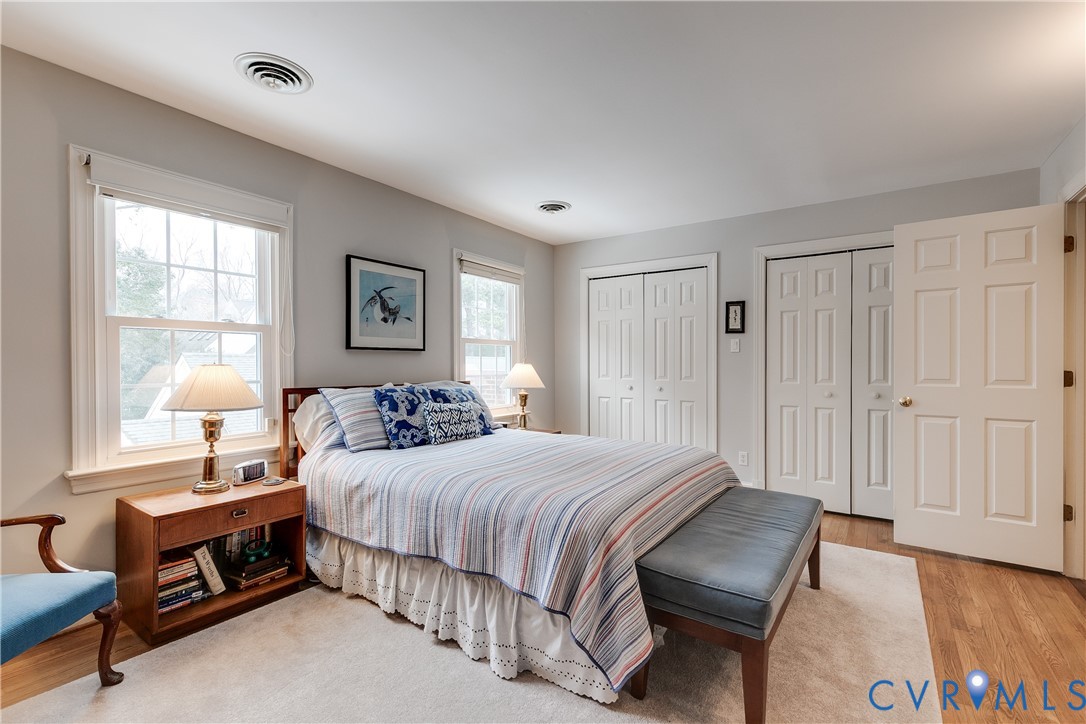498 St Albans Way Henrico, VA 23229 - Photo 26 of 46 a bedroom with a bed a lamp and a large window
