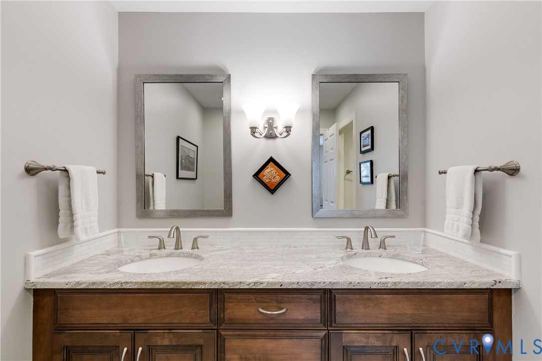 498 St Albans Way Henrico, VA 23229 - Photo 27 of 46 a bathroom with a granite countertop sink and a mirror