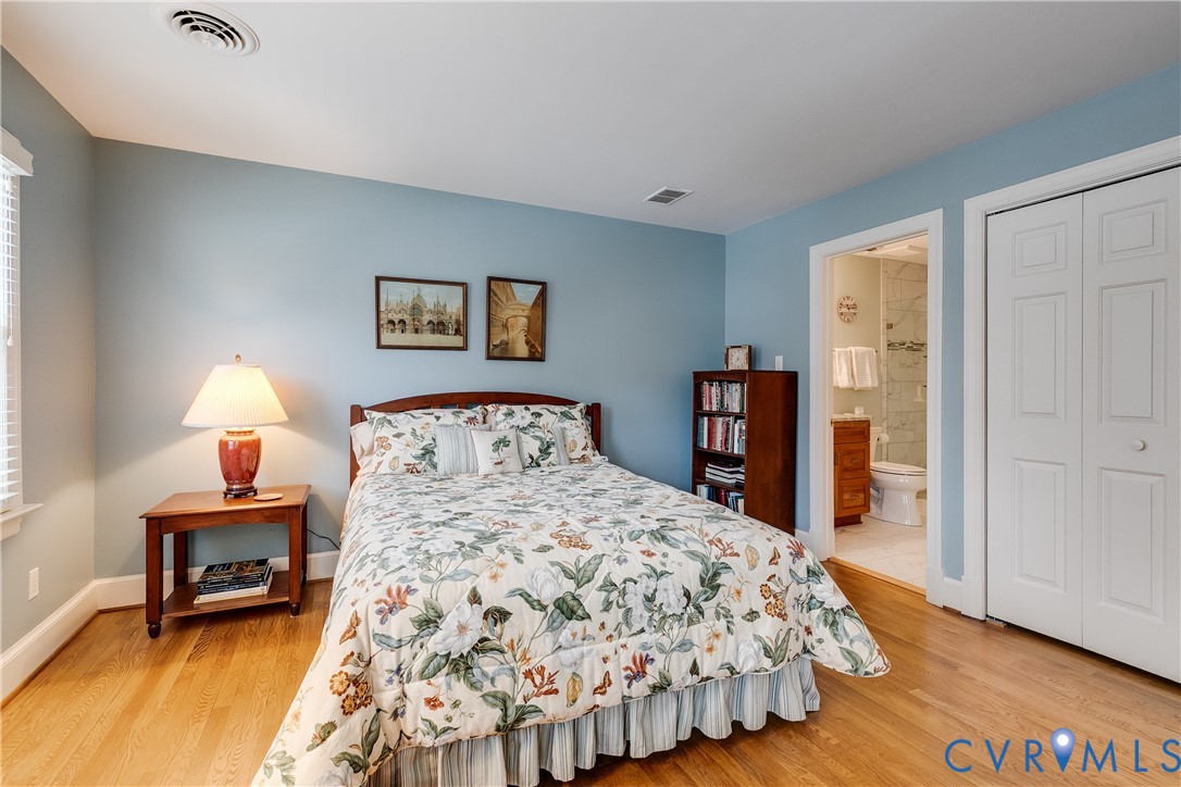 498 St Albans Way Henrico, VA 23229 - Photo 30 of 46 a bedroom with a bed and a lamp on table