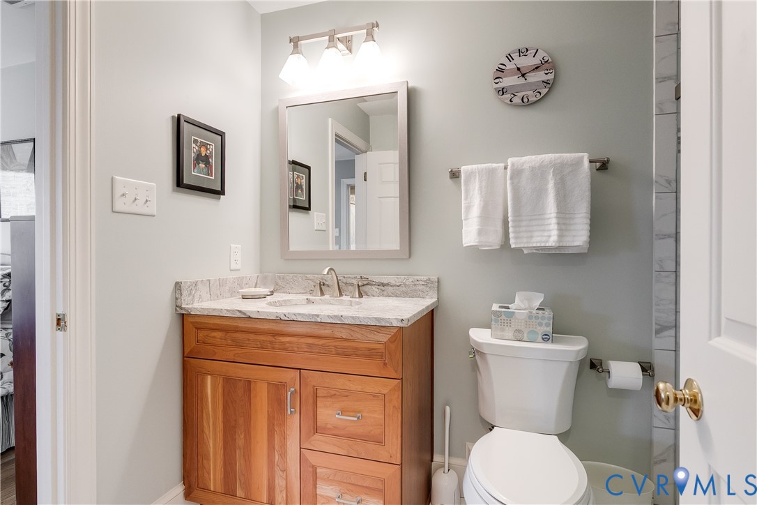 498 St Albans Way Henrico, VA 23229 - Photo 33 of 46 a bathroom with a toilet sink and mirror