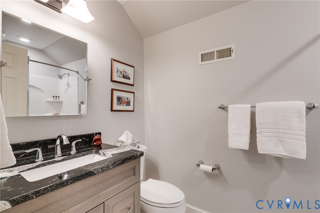 498 St Albans Way Henrico, VA 23229 - Photo 40 of 46 a bathroom with a granite countertop sink mirror vanity and toilet