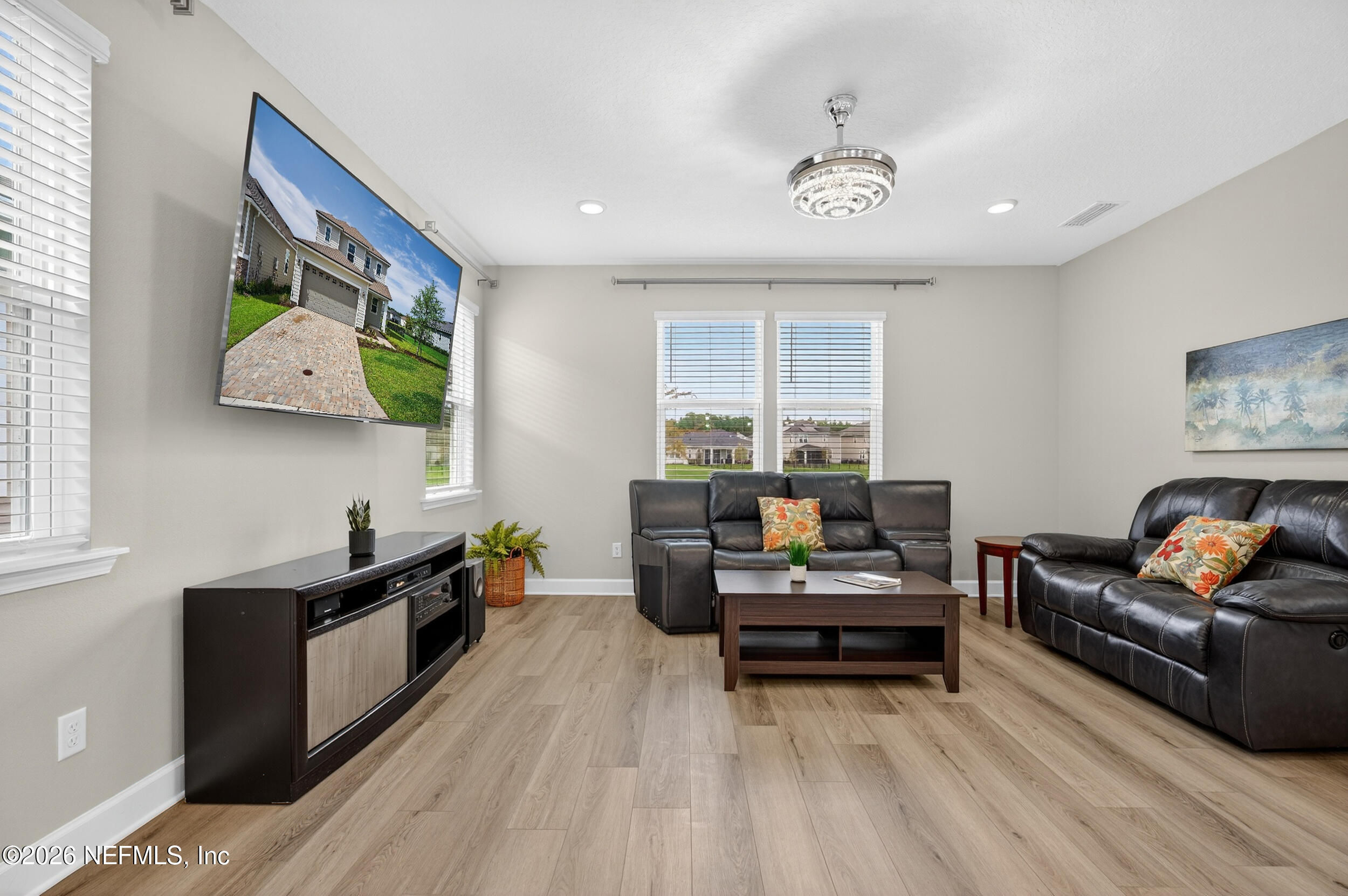 57 Cedar Elm Way St. Augustine, FL 32092 - Photo 14 of 62 a living room with furniture and a flat screen tv