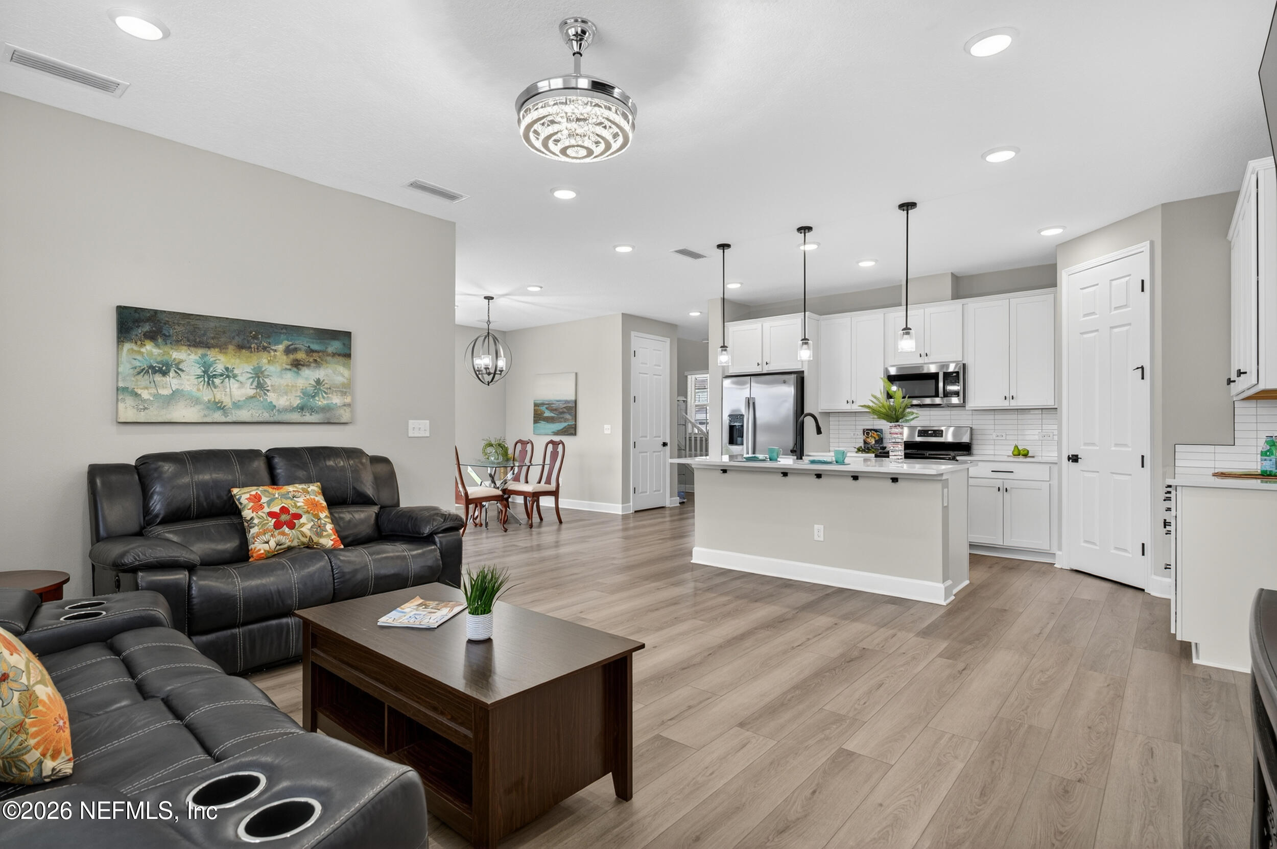 57 Cedar Elm Way St. Augustine, FL 32092 - Photo 15 of 62 a living room with stainless steel appliances kitchen island granite countertop furniture and a view of kitchen