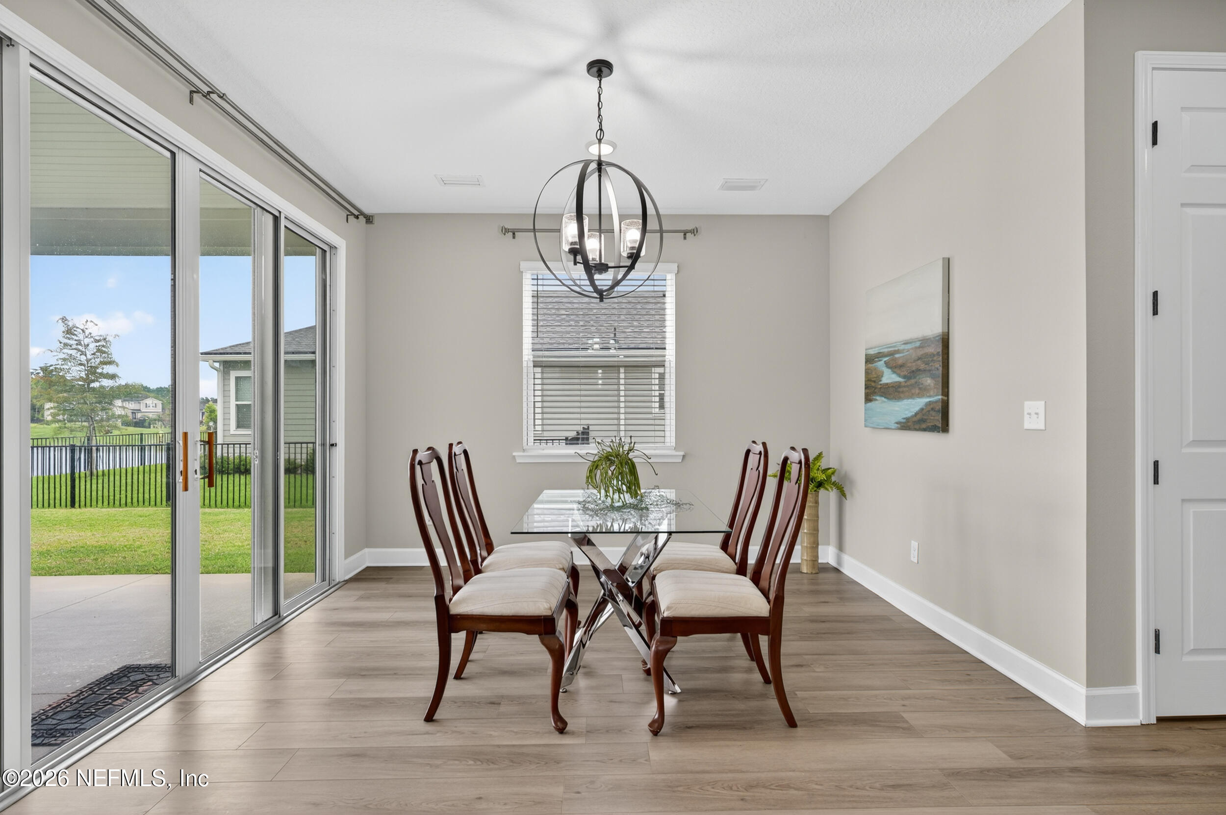 57 Cedar Elm Way St. Augustine, FL 32092 - Photo 17 of 62 a view of a dining room with furniture window and wooden floor