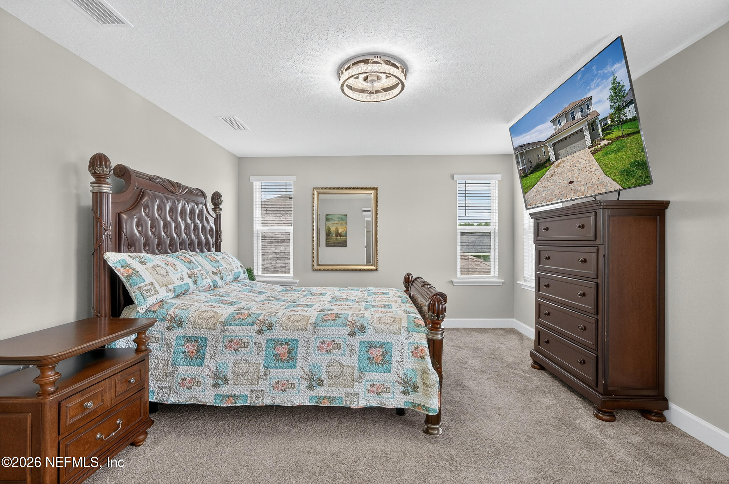 57 Cedar Elm Way St. Augustine, FL 32092 - Photo 20 of 62 a bedroom with a bed and a tv
