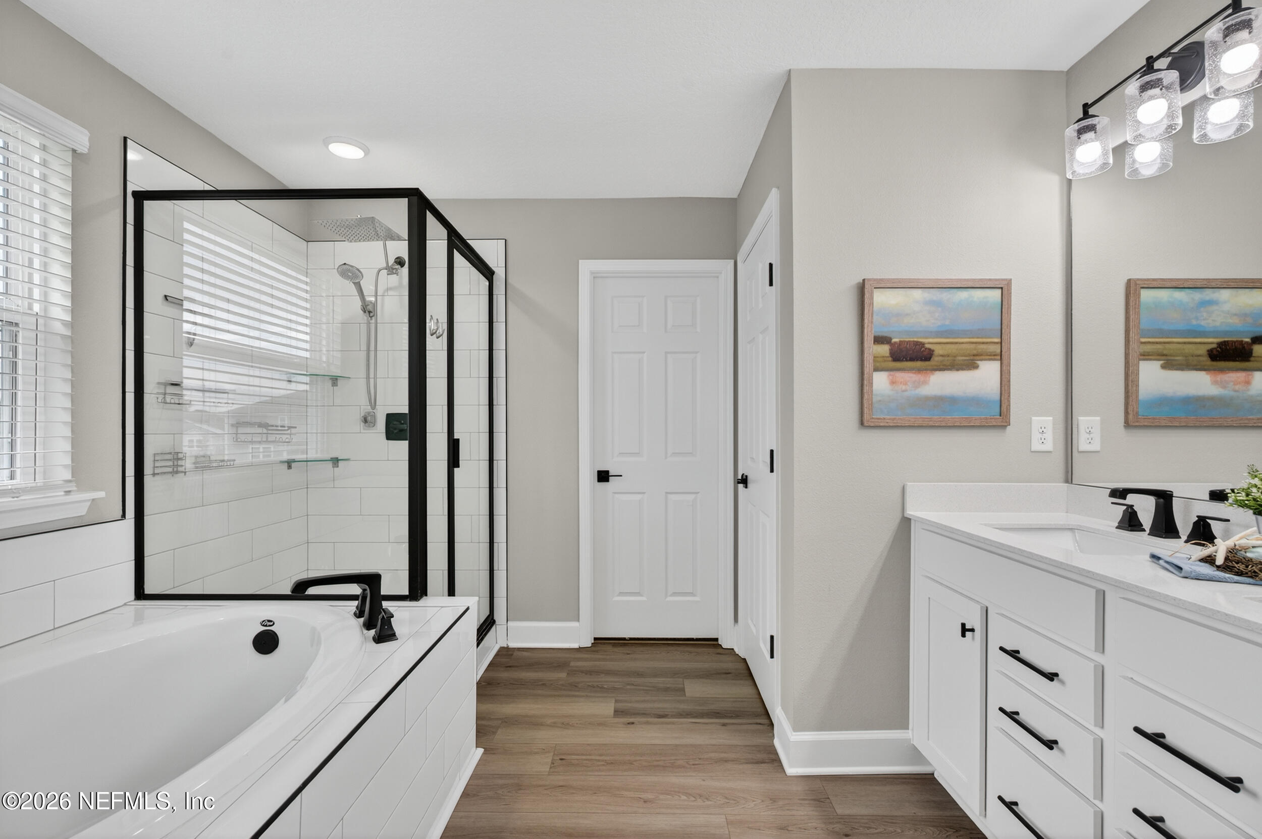 57 Cedar Elm Way St. Augustine, FL 32092 - Photo 22 of 62 a bathroom with a tub sink and mirror