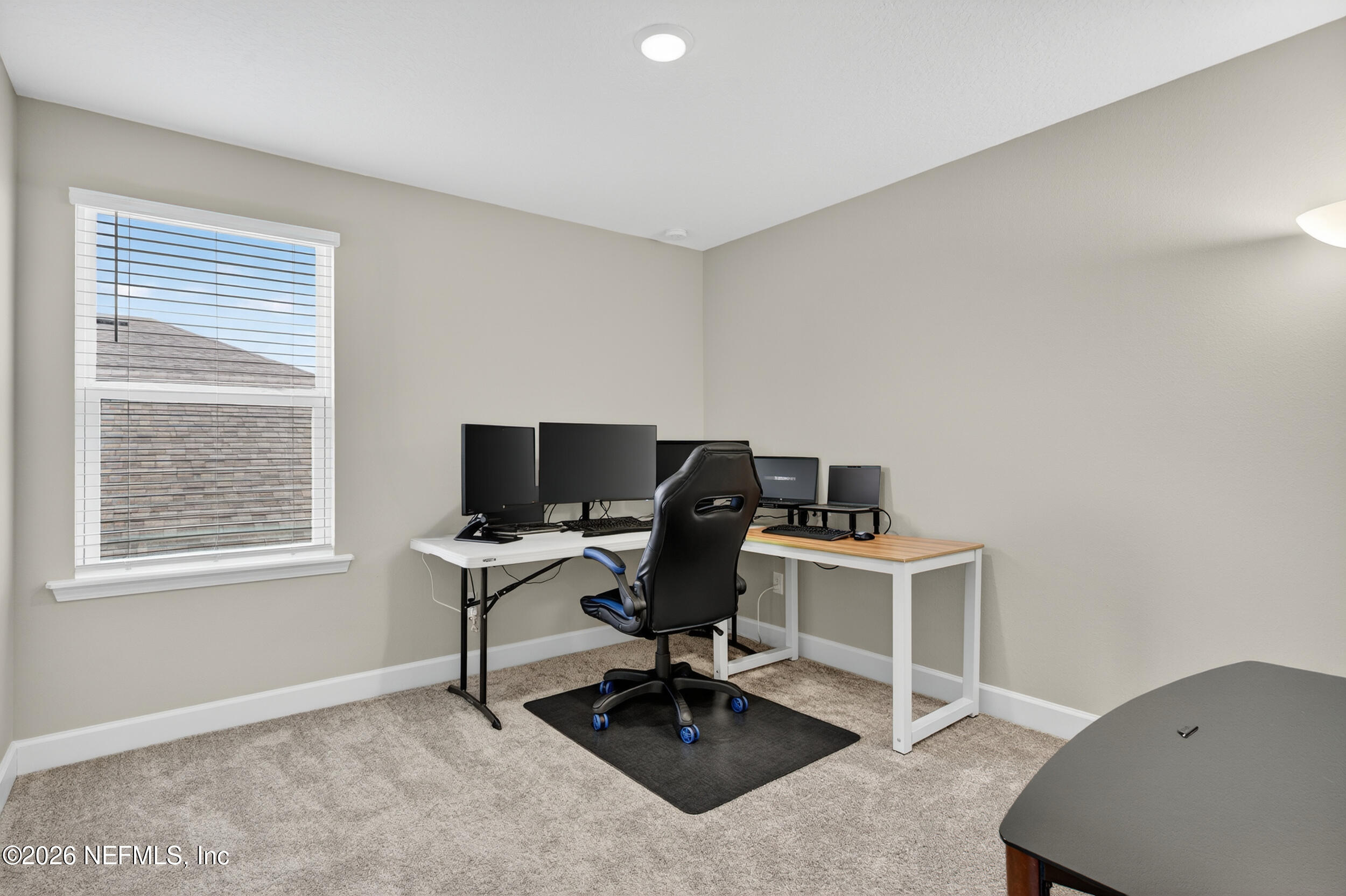 57 Cedar Elm Way St. Augustine, FL 32092 - Photo 32 of 62 a view of a workspace with furniture and a window