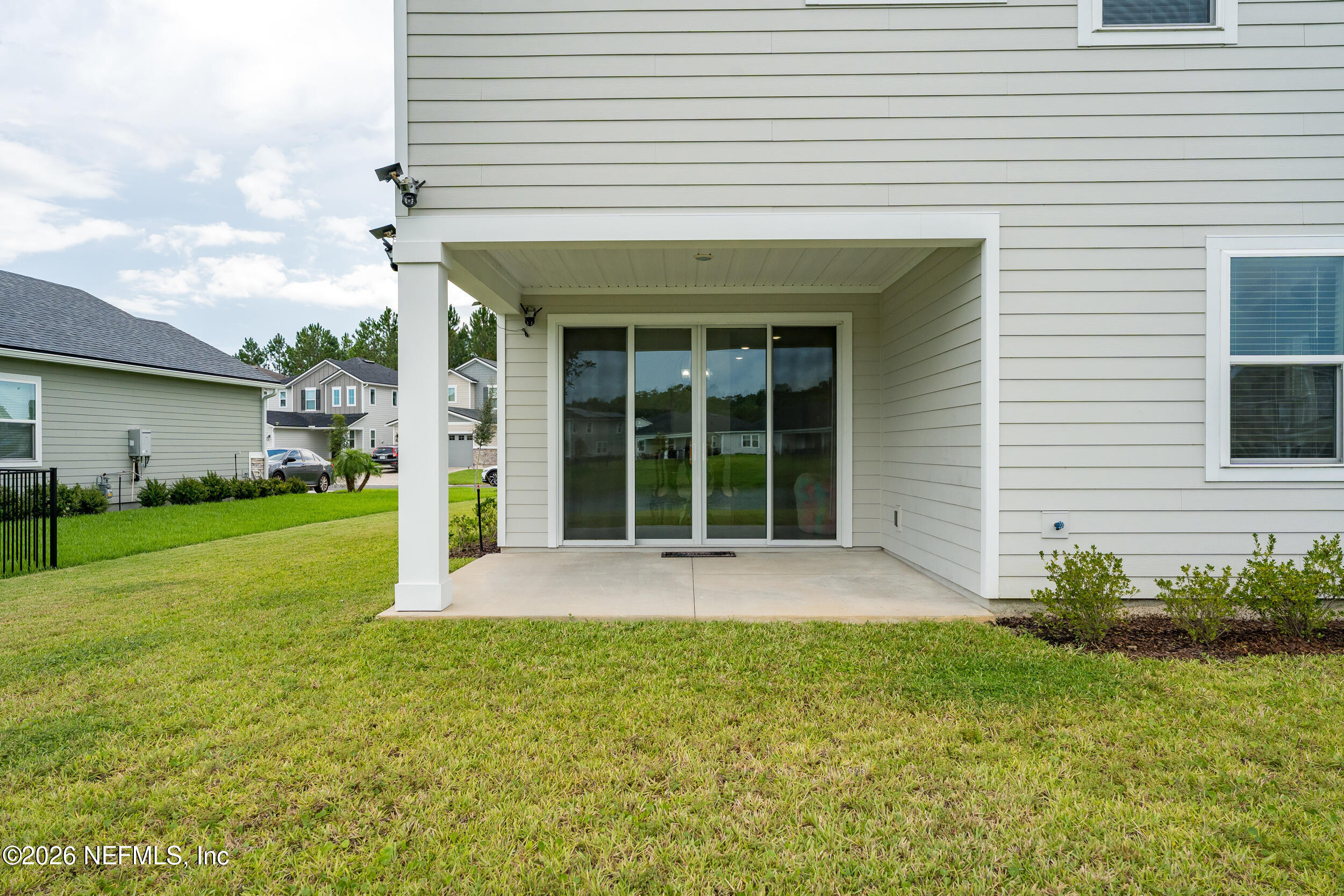 57 Cedar Elm Way St. Augustine, FL 32092 - Photo 37 of 62 a view of an house with backyard space and garden