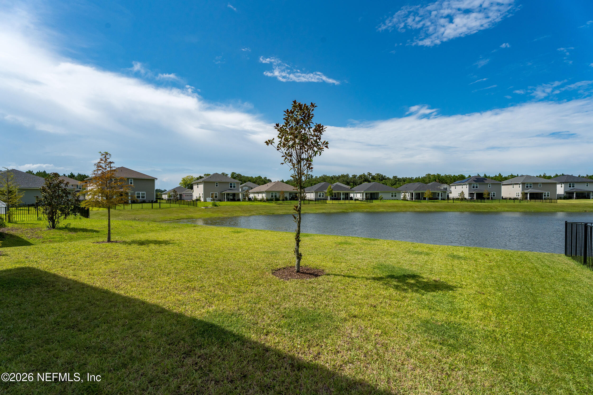 57 Cedar Elm Way St. Augustine, FL 32092 - Photo 40 of 62 a view of a lake with houses in the back