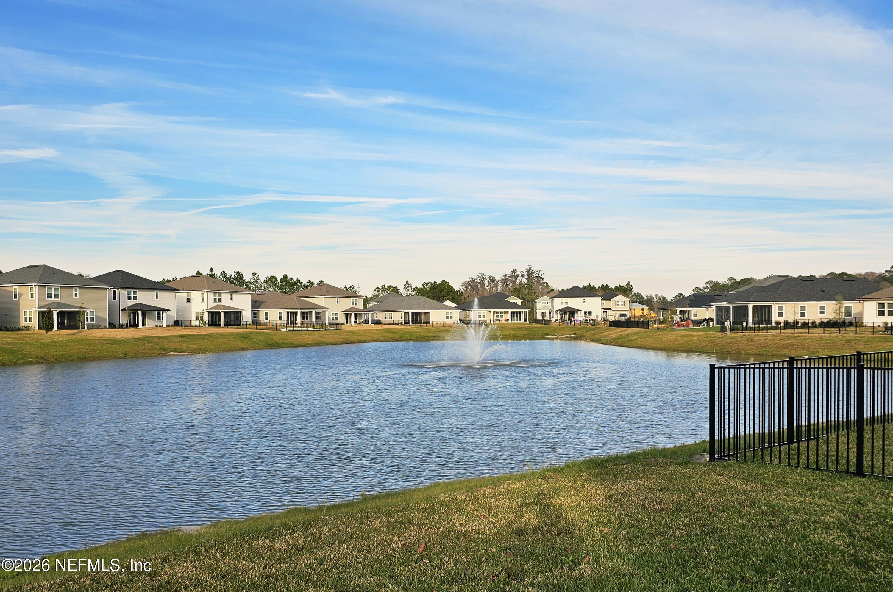 57 Cedar Elm Way St. Augustine, FL 32092 - Photo 41 of 62 a view of a lake with houses in the background