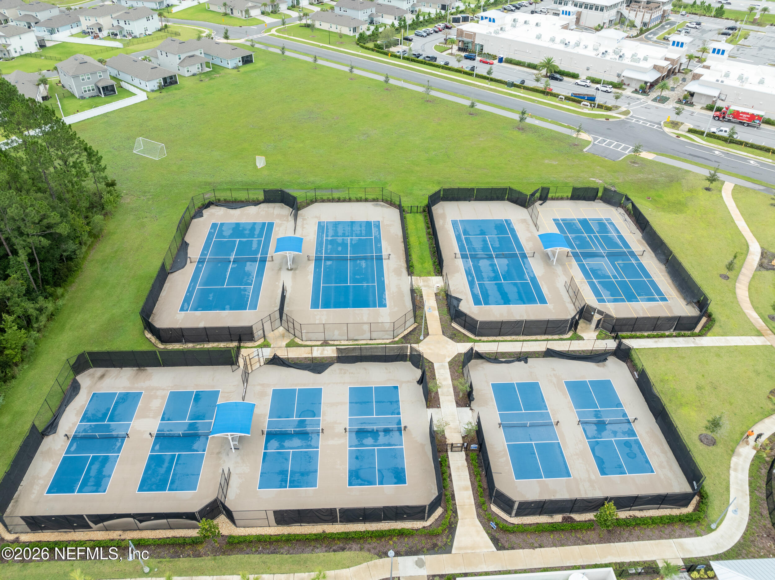 57 Cedar Elm Way St. Augustine, FL 32092 - Photo 49 of 62 a aerial view of a residential apartment building with a yard