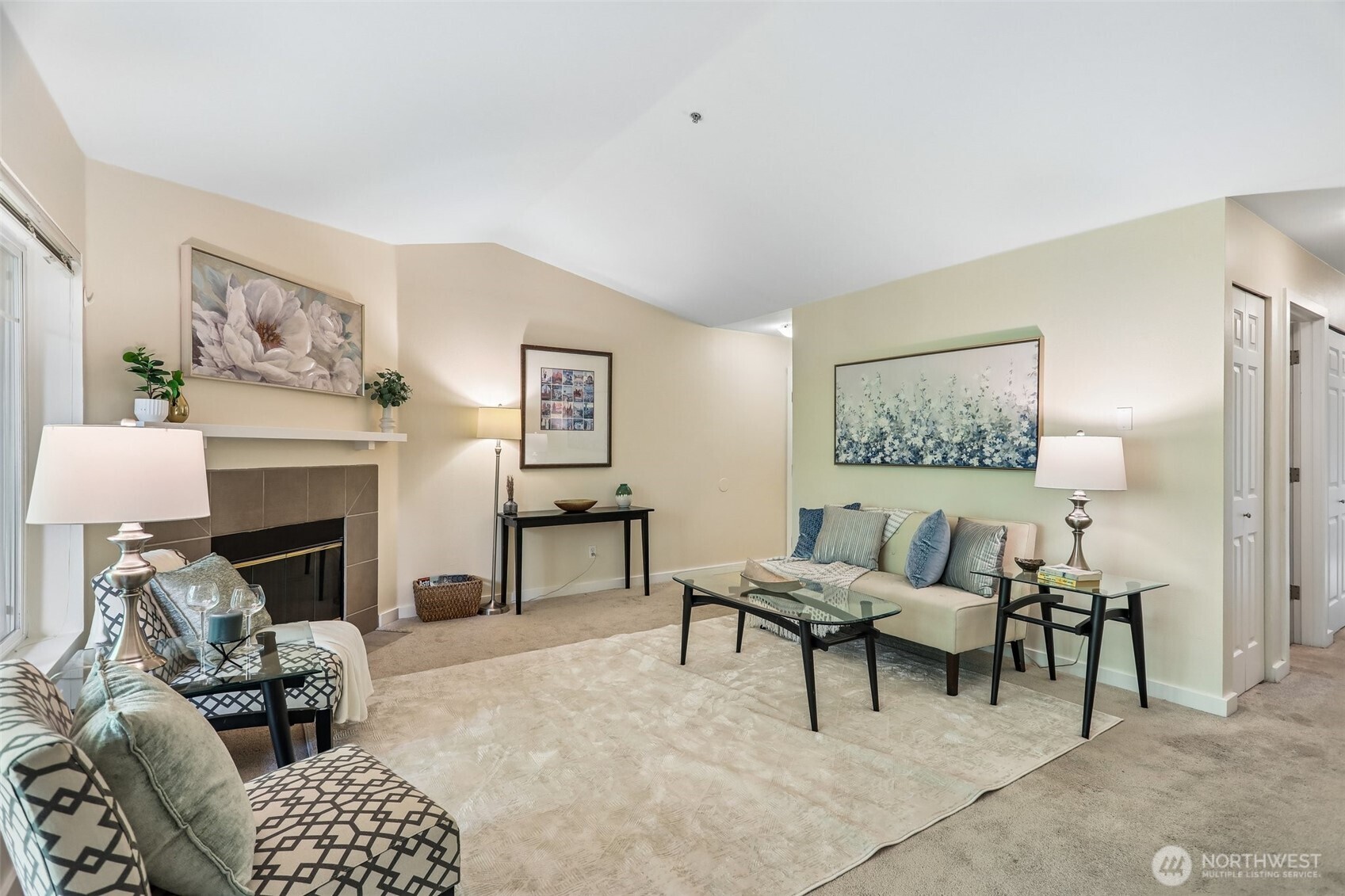 18930 Bothell Everett Highway, Unit E301 Bothell, WA 98012 - Photo 6 of 28 a living room with furniture and a fireplace