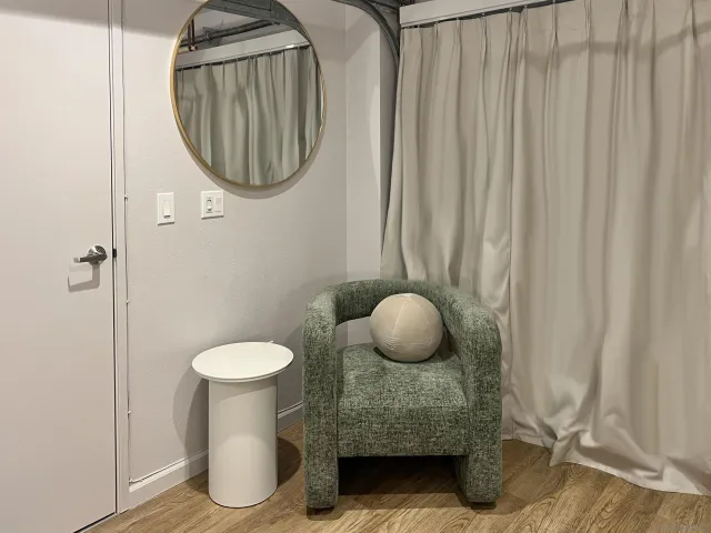 a large bed sitting in a bedroom next to a lamp