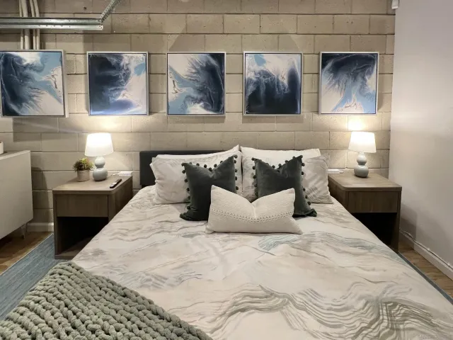 a bedroom with a bed window and walk in closet