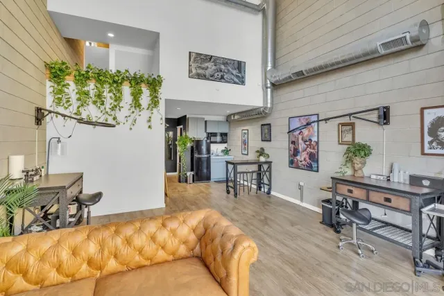 a bed room with a bed and a chair