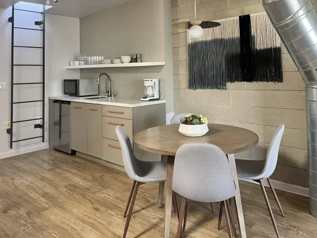 a dining room with furniture and window