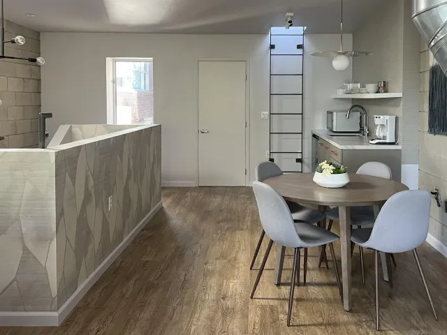 a front view of a building with a potted plant