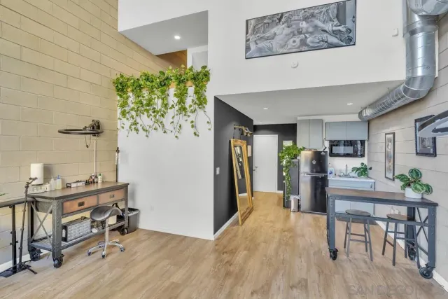 a workspace with furniture and a potted plant