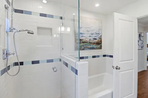 a bathroom with a bathtub and a shower