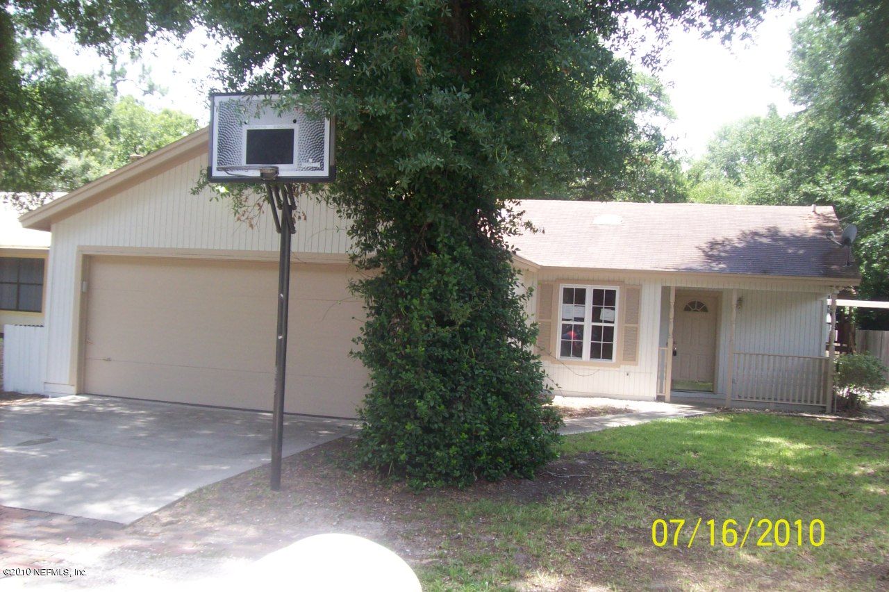 12900 Attrill Road Jacksonville, FL 32258 - Photo 1 of 7 a view of a house with a yard