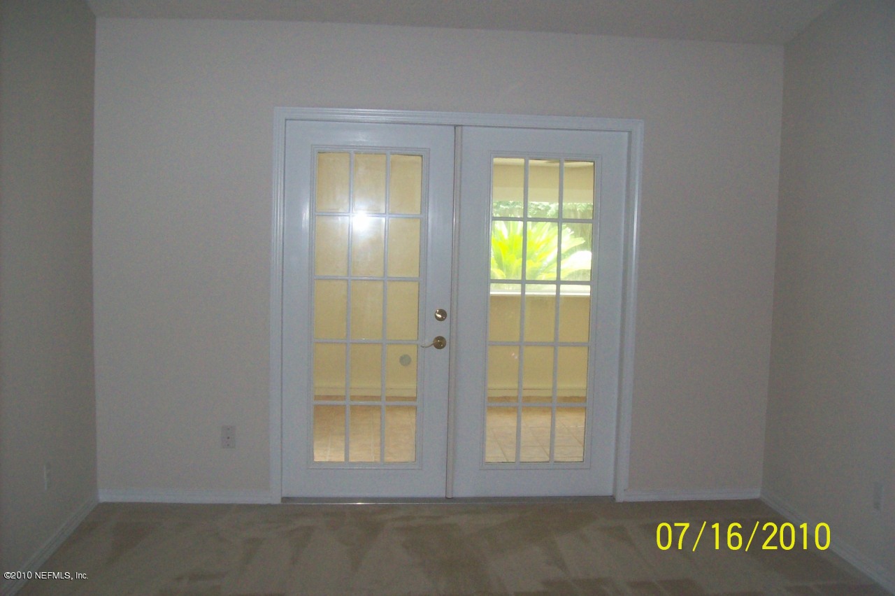 12900 Attrill Road Jacksonville, FL 32258 - Photo 5 of 7 an empty room with windows