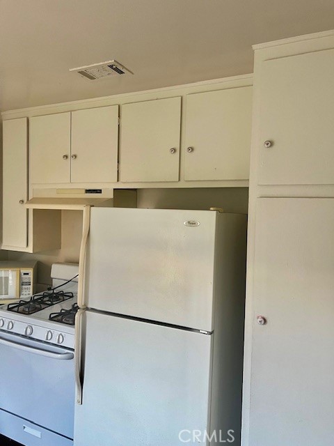 5110 Caldera Court Riverside, CA 92507 - Photo 12 of 28 a white refrigerator freezer sitting in a kitchen