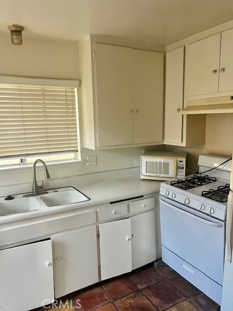 5110 Caldera Court Riverside, CA 92507 - Photo 13 of 28 a kitchen with appliances cabinets and a sink