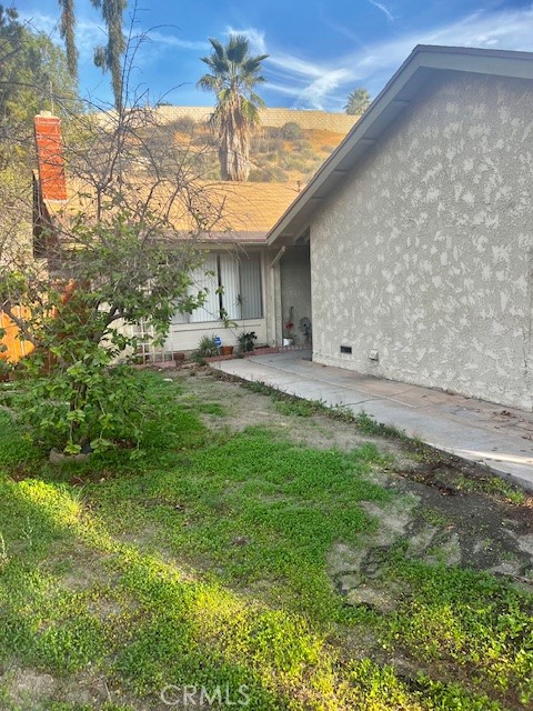 5110 Caldera Court Riverside, CA 92507 - Photo 2 of 28 a view of a backyard with plants and a patio