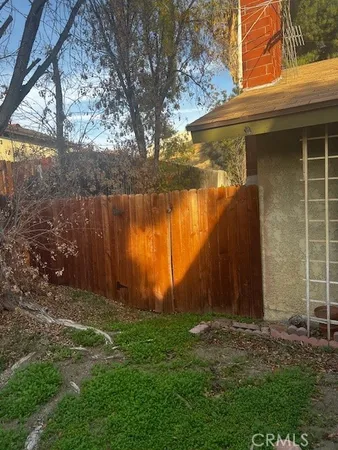 a view of a backyard of the house