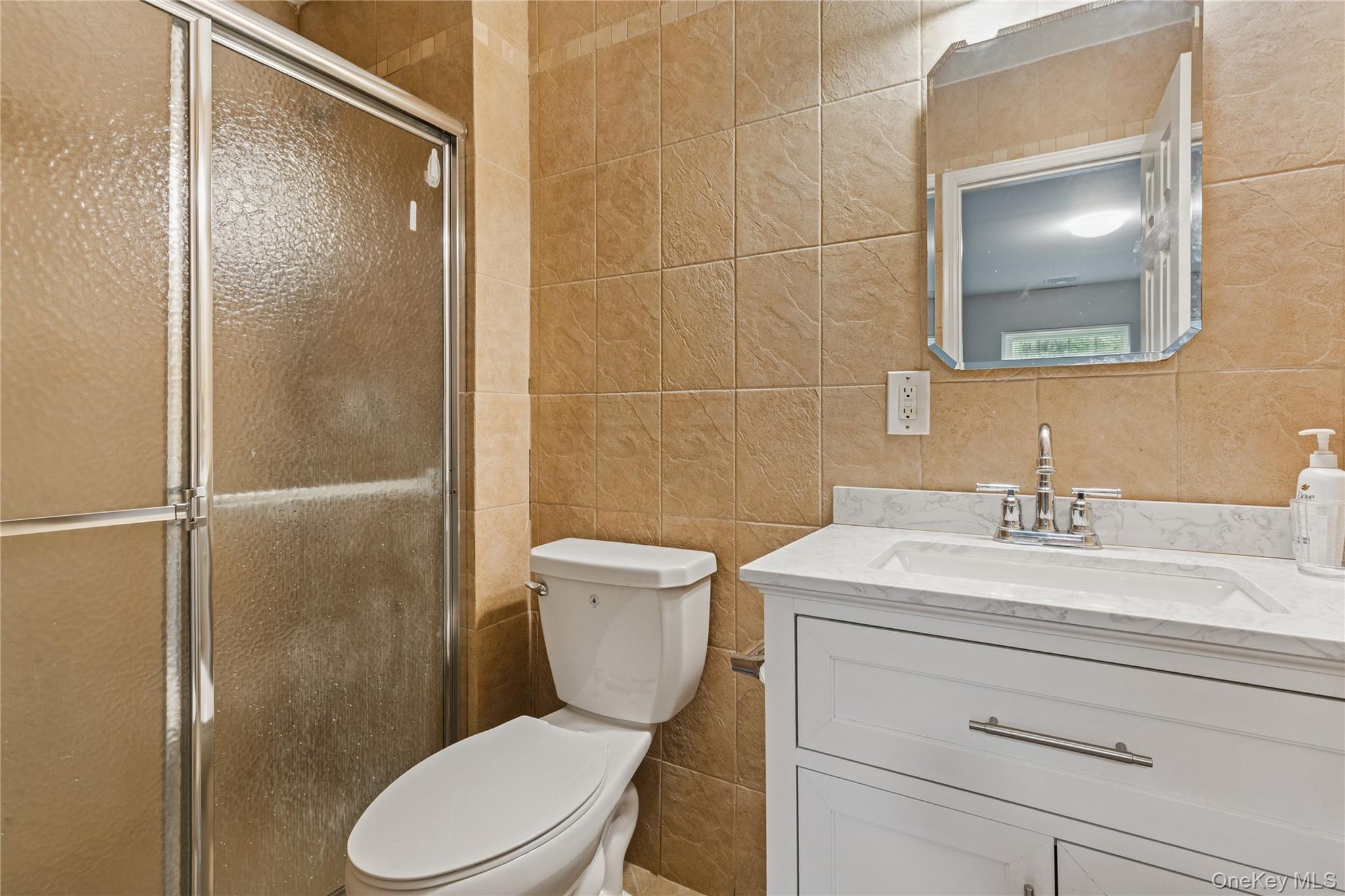 241 Fairview Circle Middle Island, NY 11953 - Photo 13 of 24 a bathroom with a toilet a sink and shower