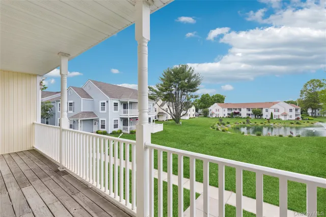 a view of a house with wooden fence