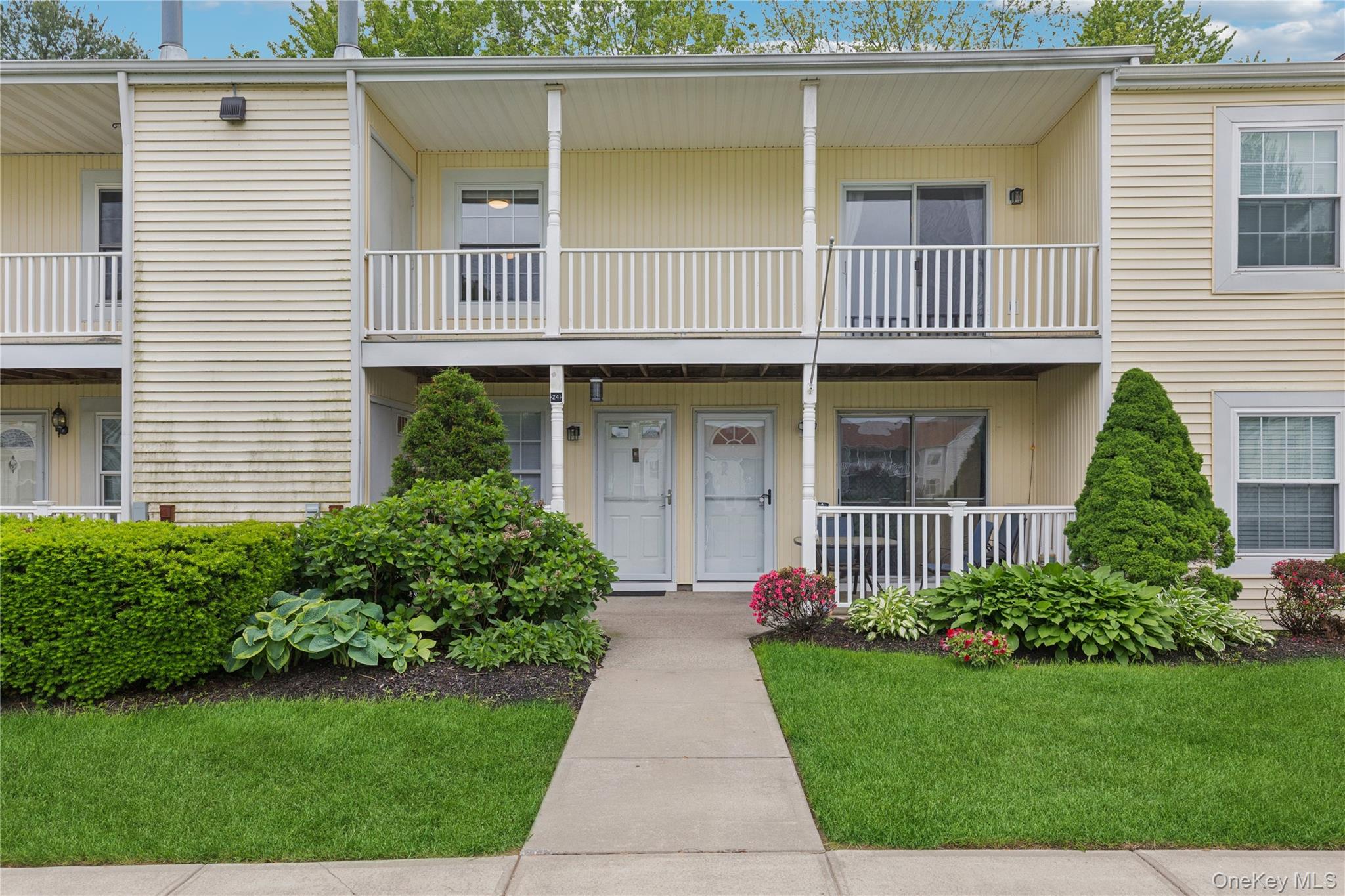 241 Fairview Circle Middle Island, NY 11953 - Photo 23 of 24 a front view of a house with garden