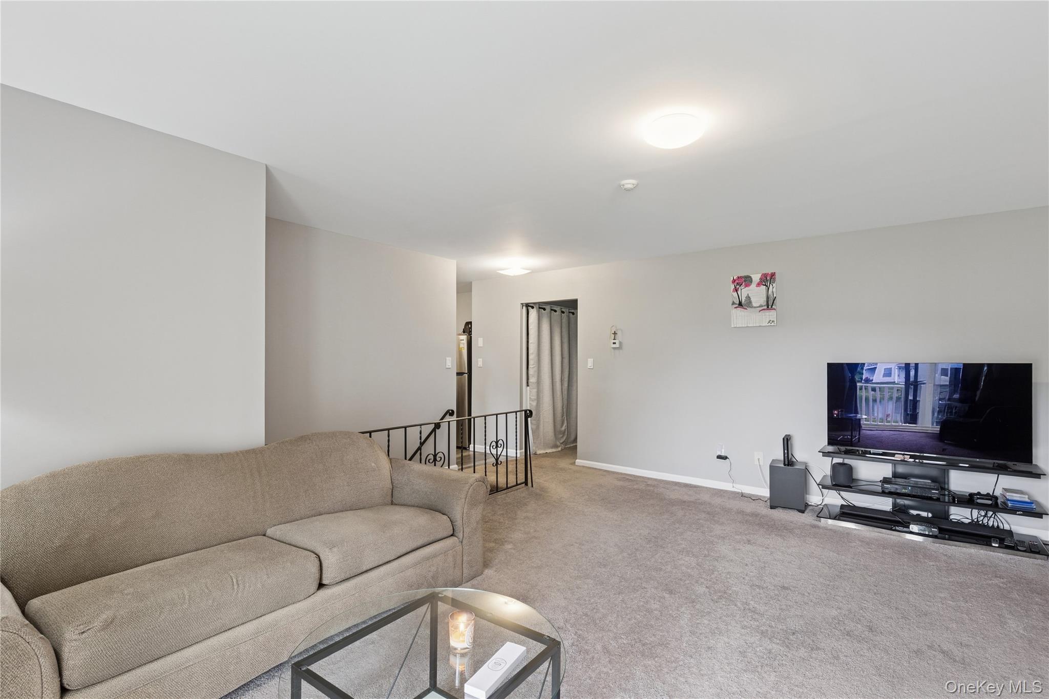 241 Fairview Circle Middle Island, NY 11953 - Photo 5 of 24 a living room with furniture and a flat screen tv