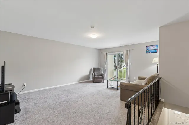 a view of a livingroom with furniture and windows