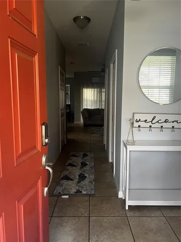 a view of a hallway with washer and dryer