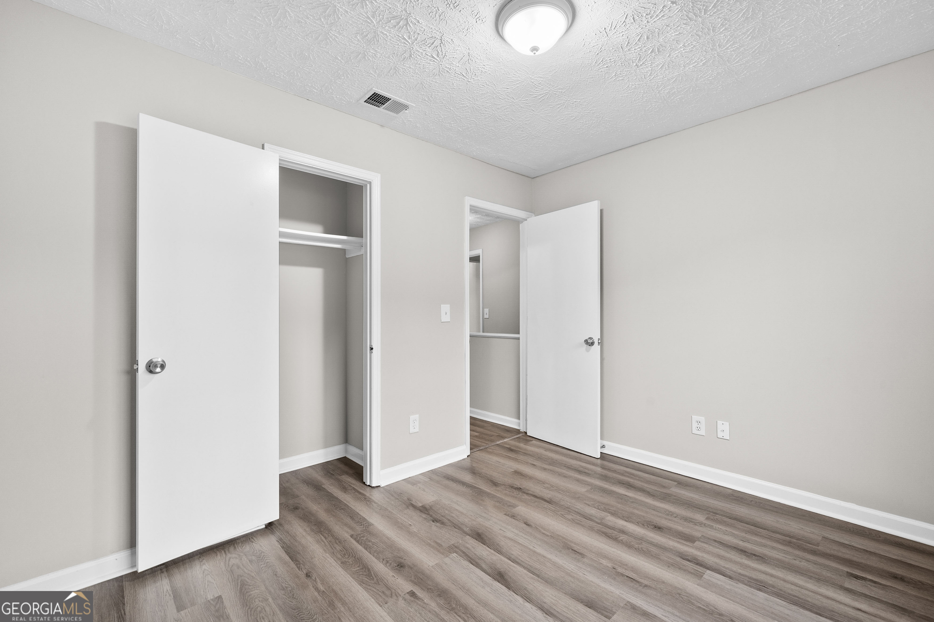 6706 Bent Creek Drive Rex, GA 30273 - Photo 12 of 27 a view of an empty room with wooden floor