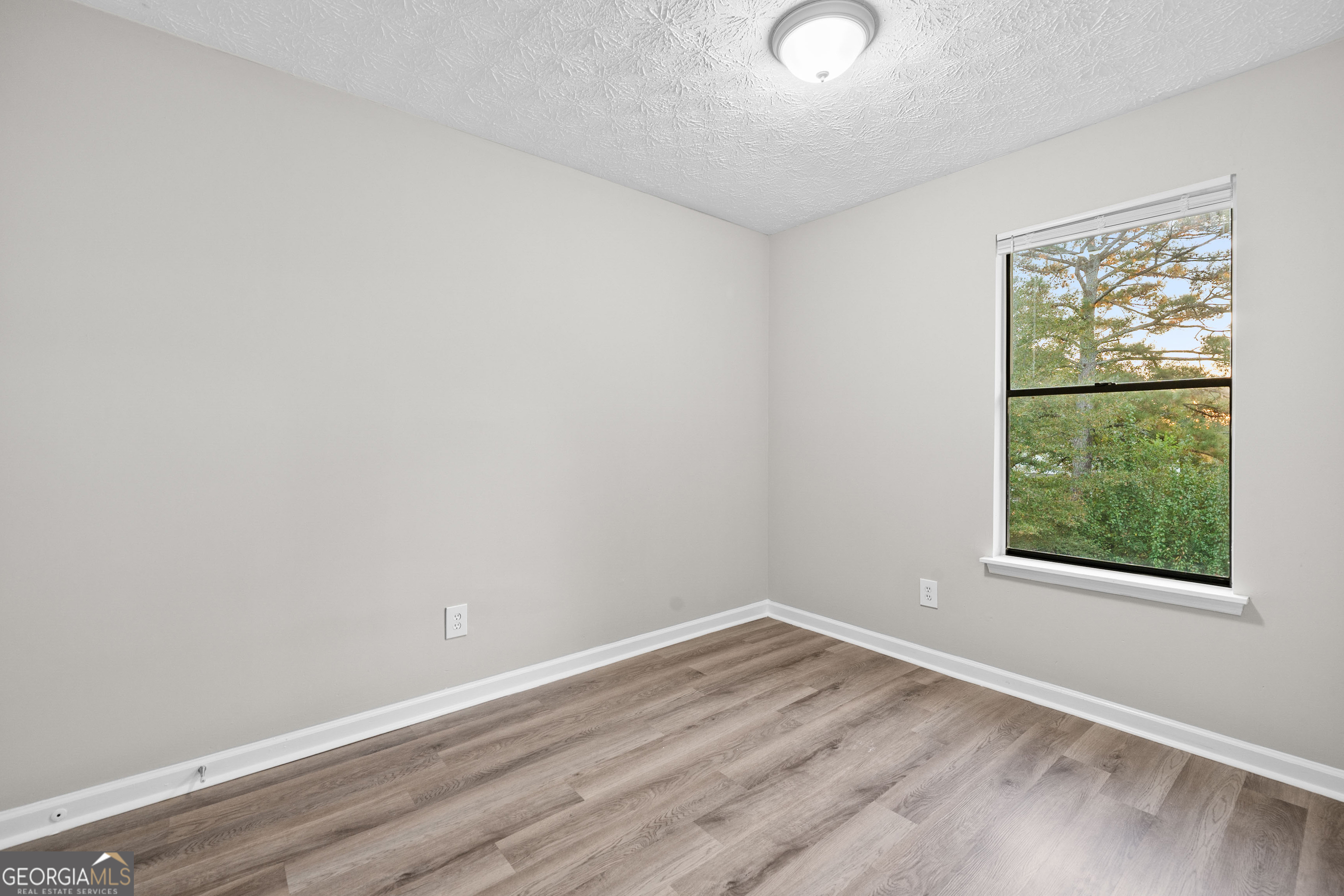 6706 Bent Creek Drive Rex, GA 30273 - Photo 13 of 27 an empty room with a window