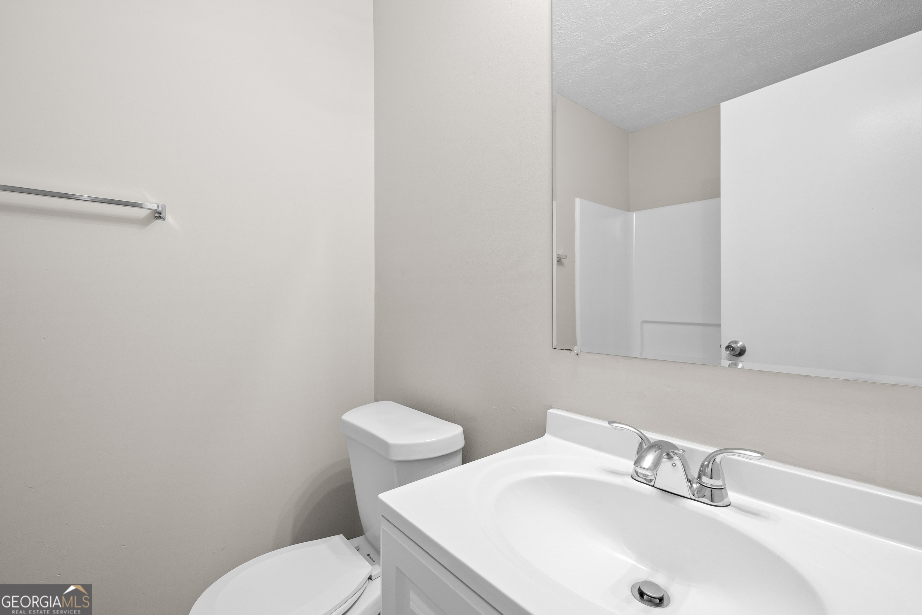 6706 Bent Creek Drive Rex, GA 30273 - Photo 15 of 27 a bathroom with a sink and a toilet