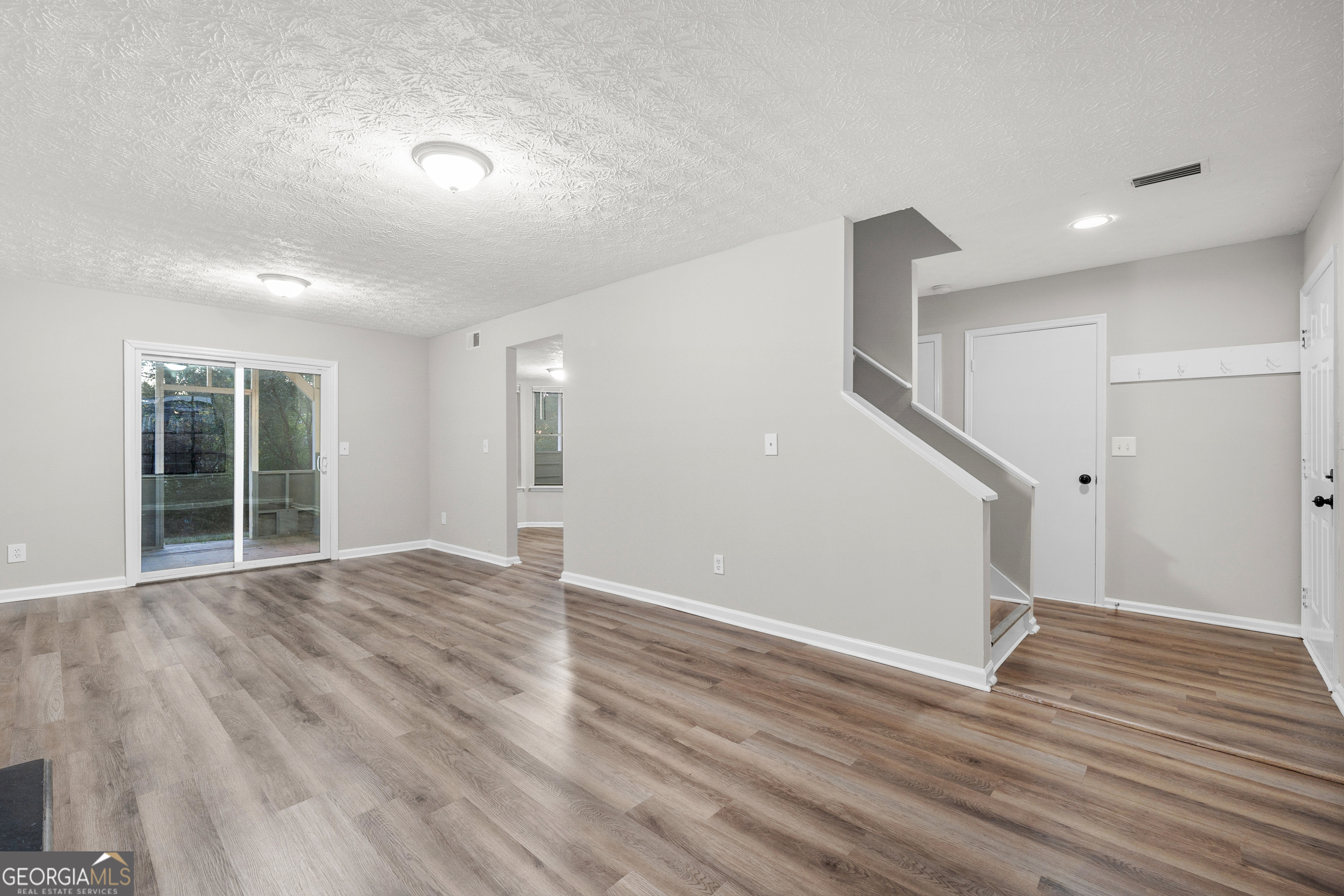 6706 Bent Creek Drive Rex, GA 30273 - Photo 18 of 27 a view of empty room with wooden floor and fan