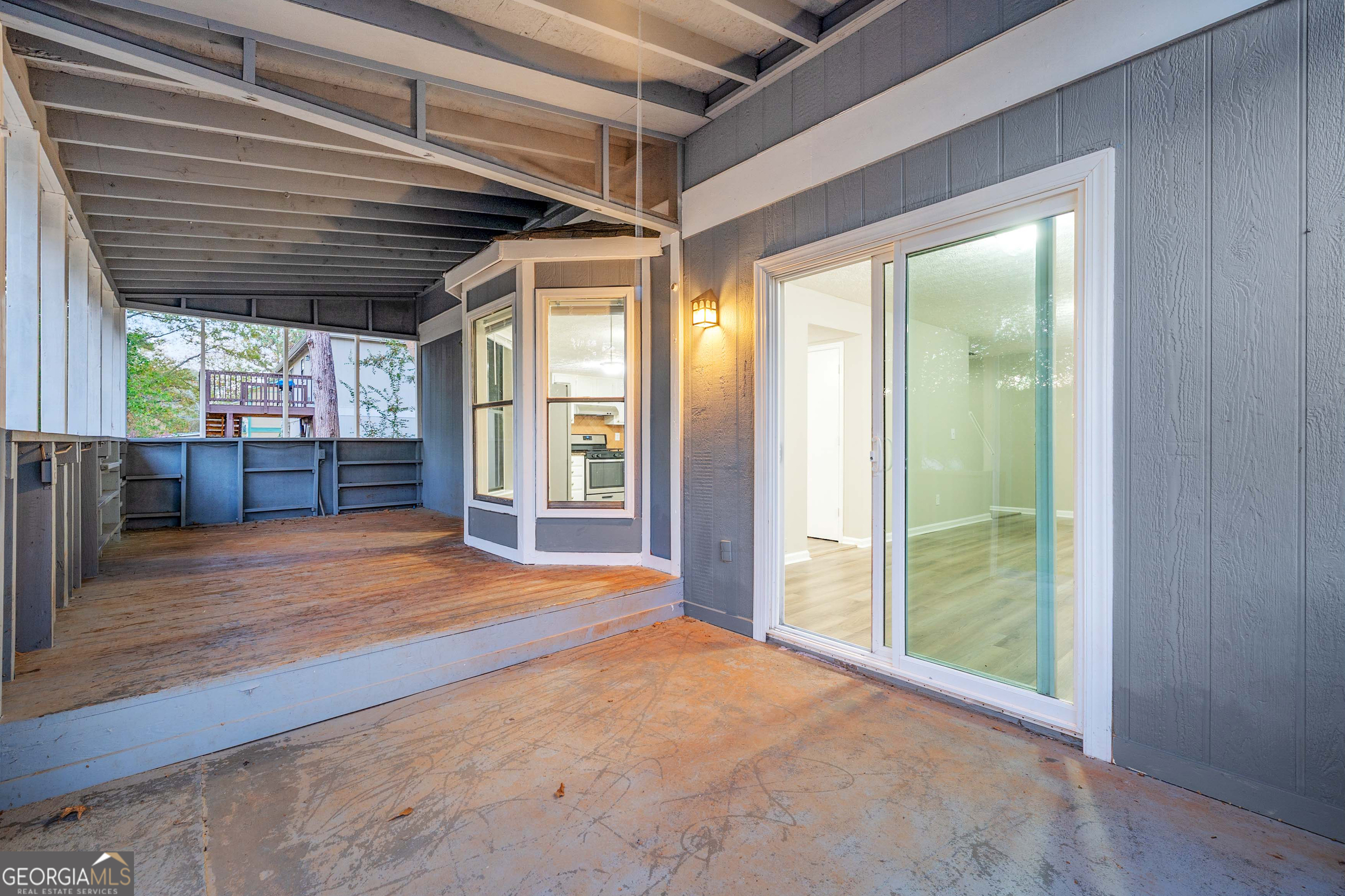 6706 Bent Creek Drive Rex, GA 30273 - Photo 23 of 27 a view of an empty room with wooden floor and a window