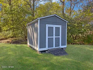 a view of a backyard with barn