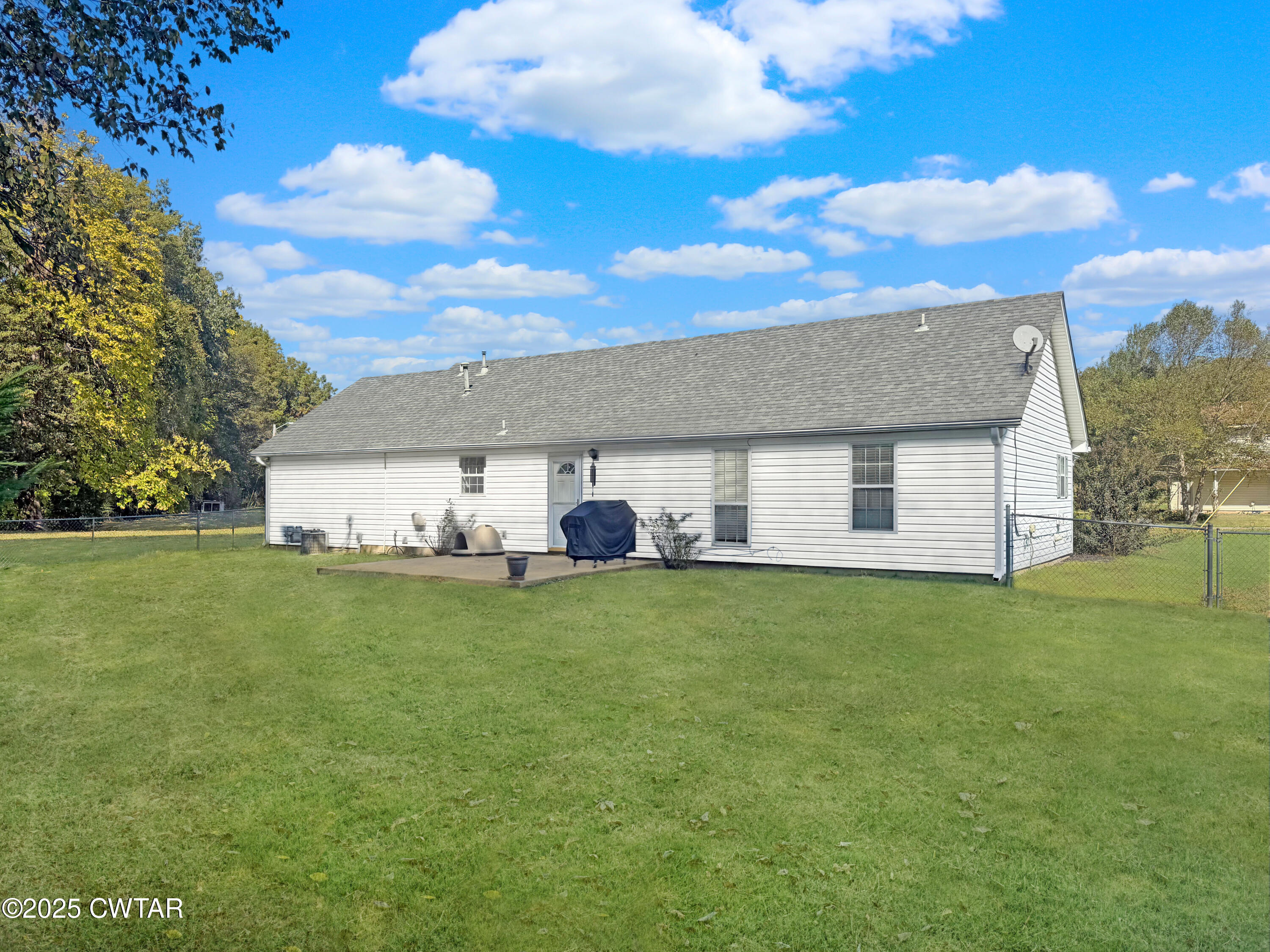 45 Village Avenue Ripley, TN 38063 - Photo 2 of 11 a view of a yard in front of a house with a large tree
