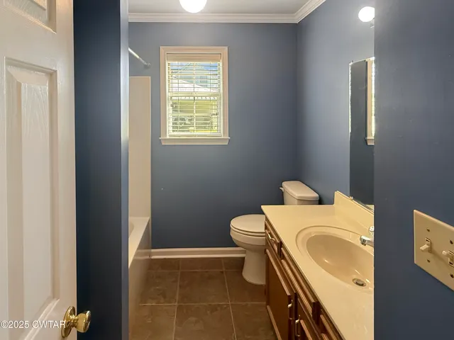 a bathroom with a sink and toilet