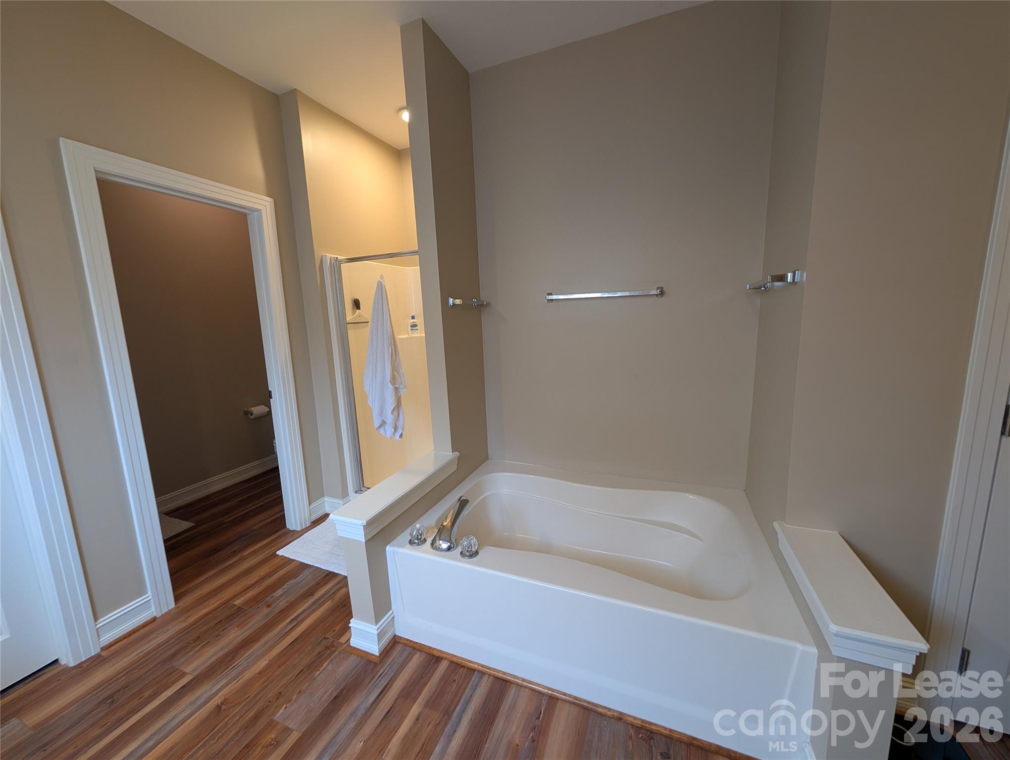 20207 Colony Point Lane Cornelius, NC 28031 - Photo 17 of 26 a bathroom with a bathtub and a shower