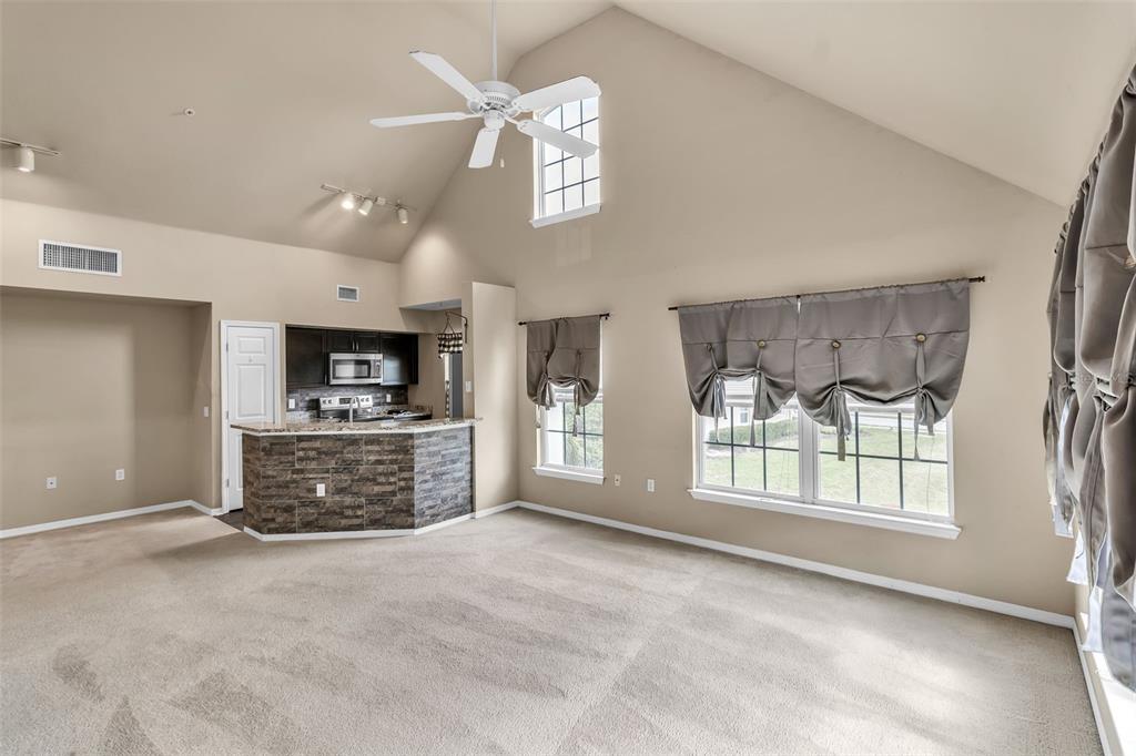 5511 Rosehill Road, Unit 203 Sarasota, FL 34233 - Photo 14 of 49 a view of a windows and a flat screen tv in a room