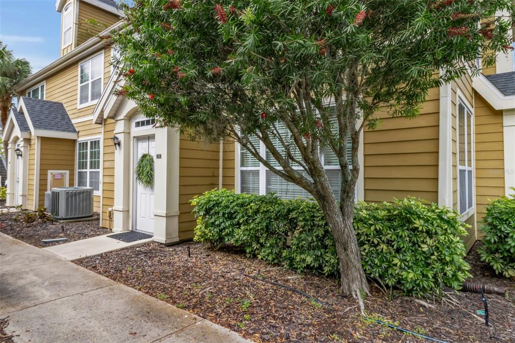 5511 Rosehill Road, Unit 203 Sarasota, FL 34233 - Photo 2 of 49 a front view of a house with garden